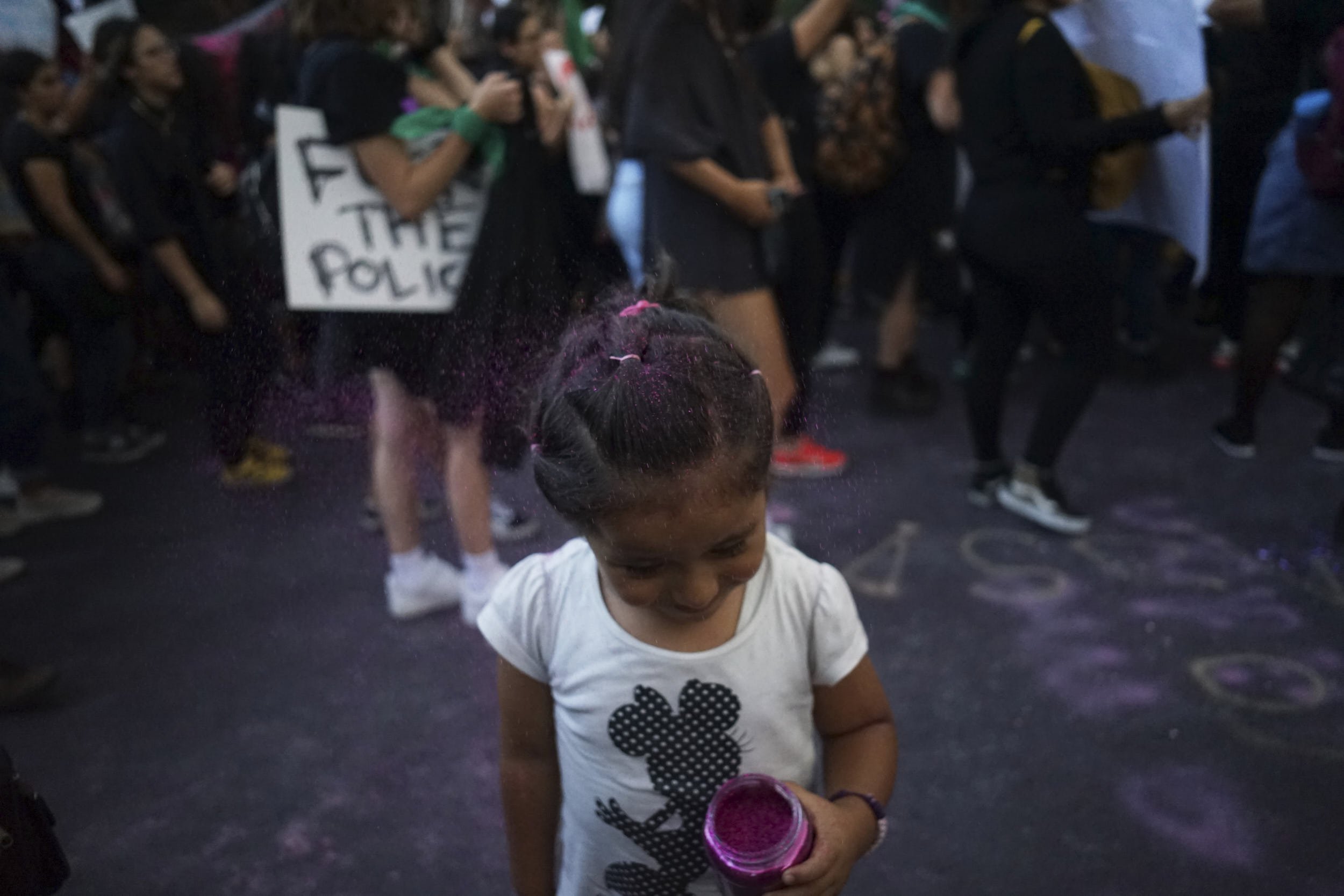 A gird takes part in a protest called "They Don't Protect Me, to demand for their safety in the city and justice for two teenage girls that local were raped by policemen, in Mexico City, Mexico, August 16, 2019. REUTERS/Mariana Greif