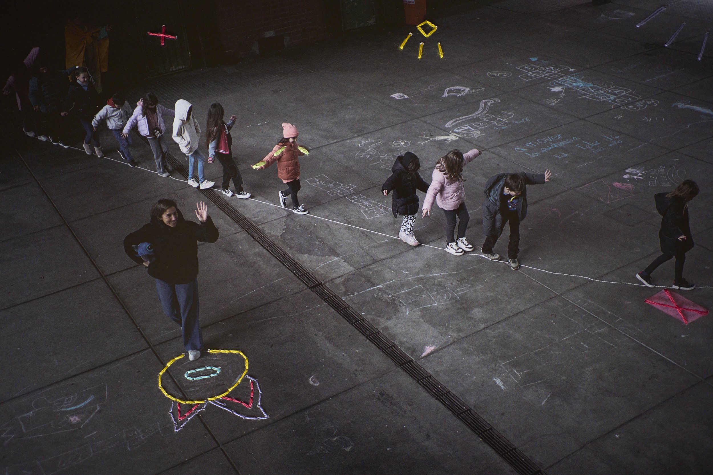  Lucia waves during the celebration of Children´s day in the common areas. Embroidery by Triana 