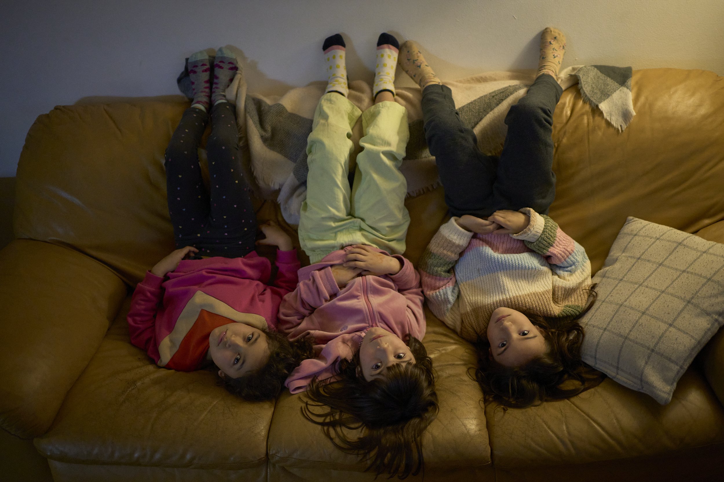  Friends and neighbours Guadalupe, Bruna and Juana pose for a picture in Bruna's home. Their fathers grew up together in the Complejo, later moved out and now moved back in to make their own families, close to their friends. 