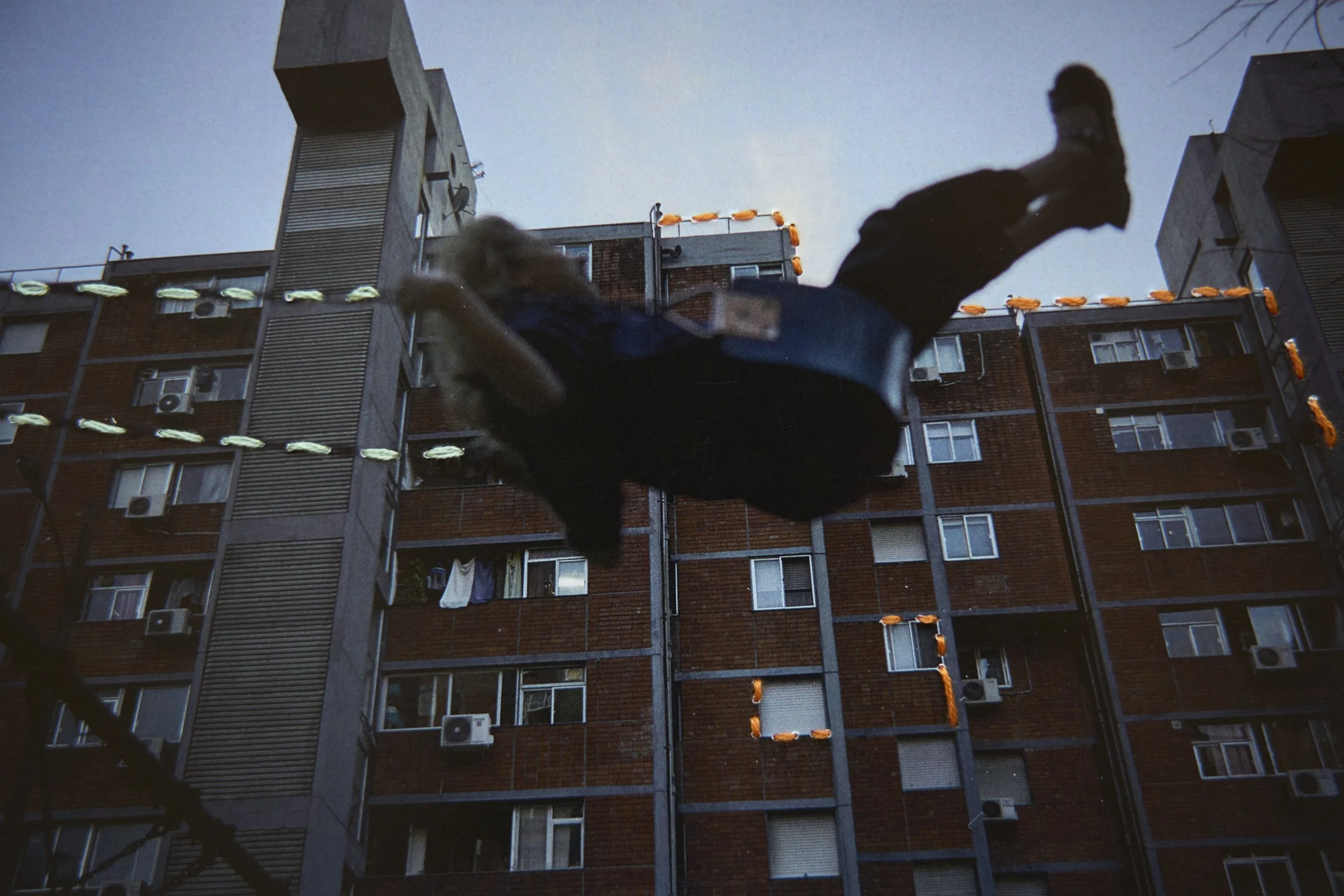  Emlia plays in the common area. Embroidery by Triana. 