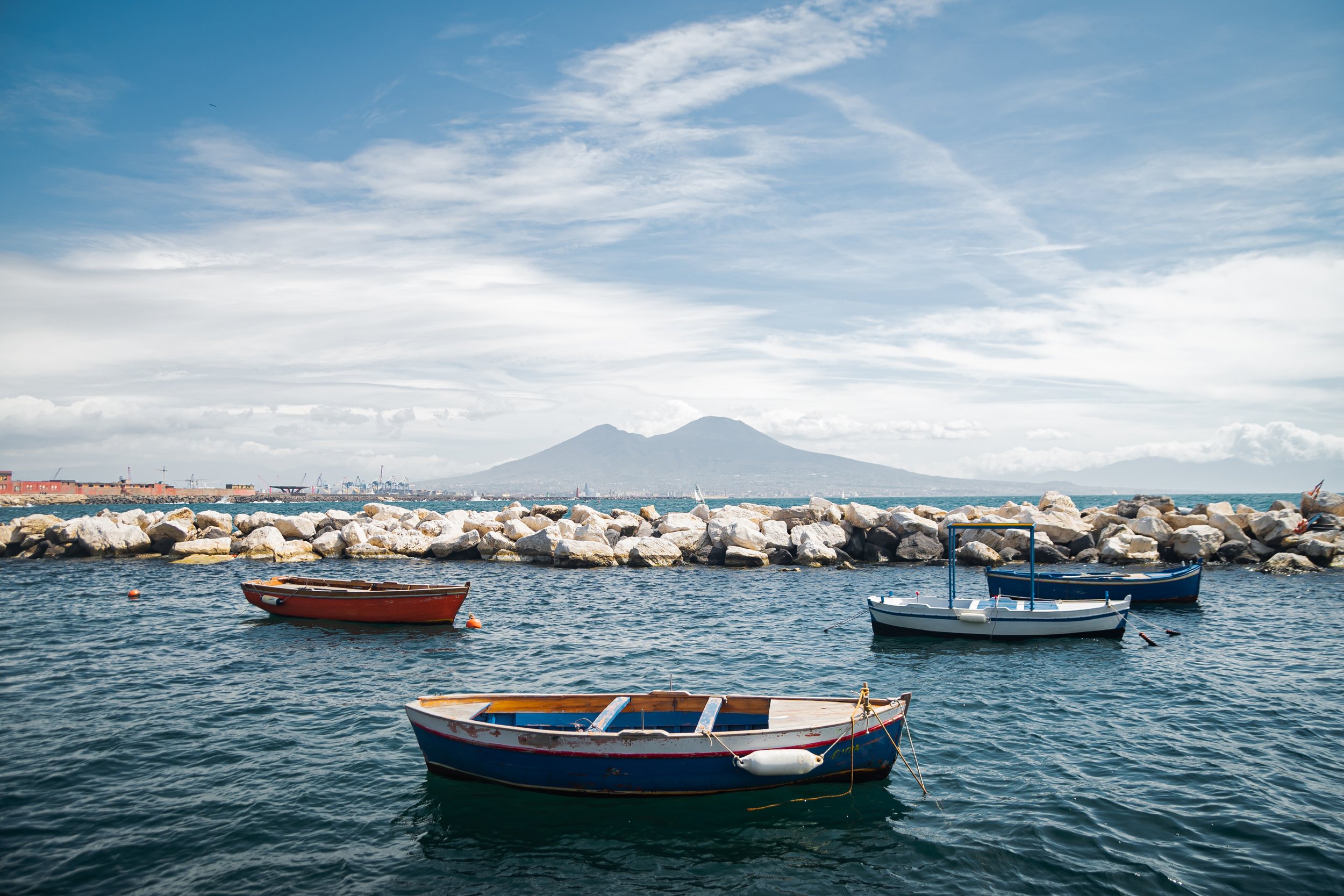 calm-blue-tyrrhenian-sea-view-from-embankment-naples-mount-vesuvius-volcano-pleasure-boats-moored-near-shore-stone-breakwaters-beautiful-landscape-meditation.jpg