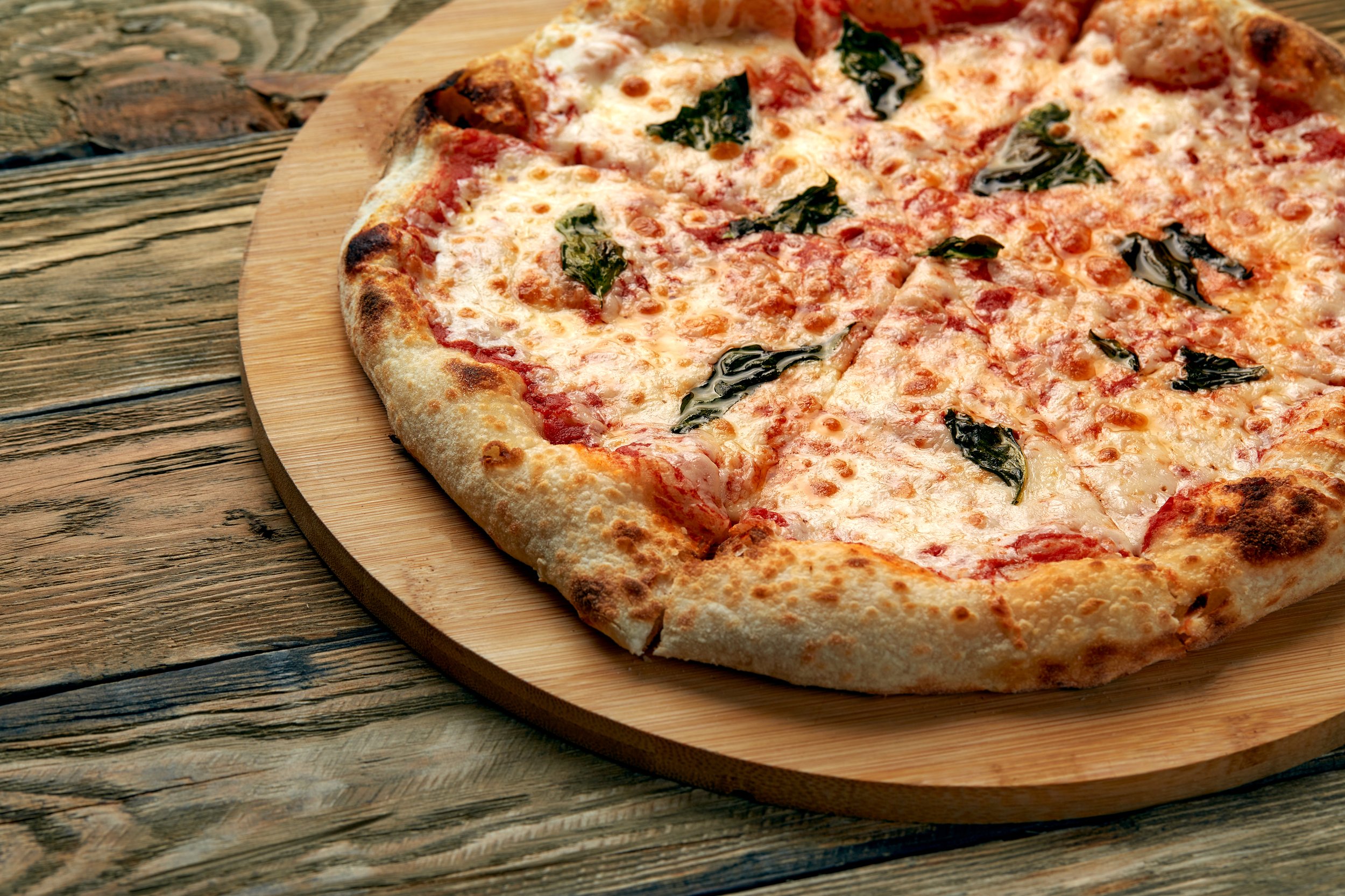 whole-neapolitan-pizza-served-wooden-board.jpg