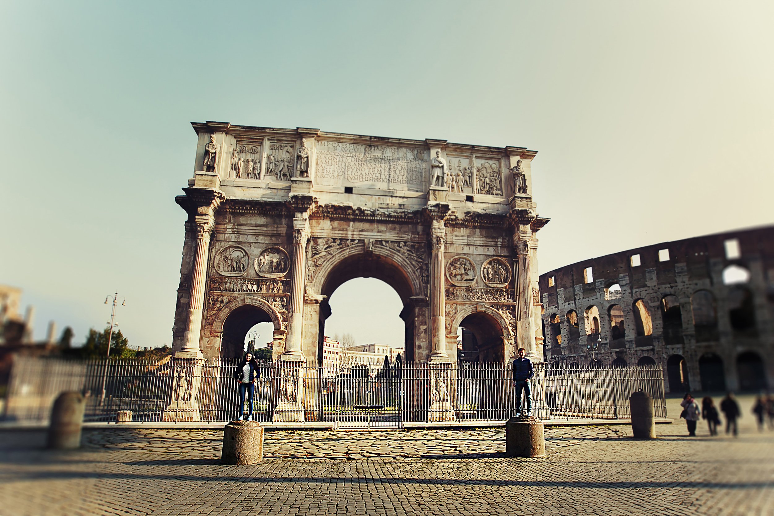 two-people-standing-colums-near-arch-constantine.jpg