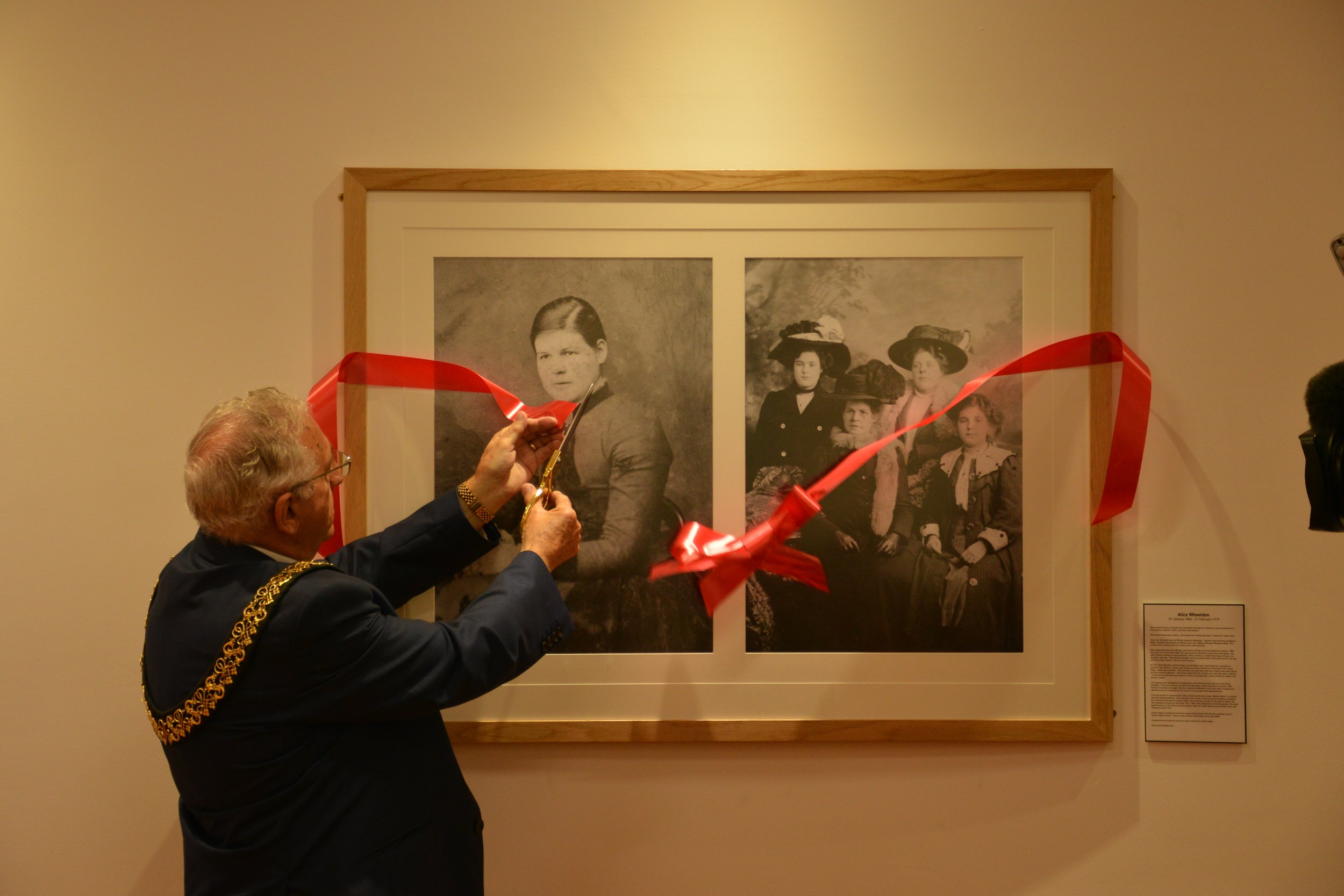  Mayor Frank Heyward cuts the ribbon to open the Alice Wheeldon Room. 