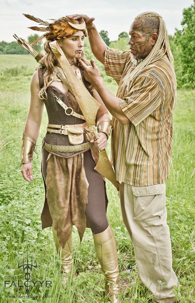 Ahura, the director, putting the final touches on my headdress. Photo Credit: Sinari Diliiza of Unicovia Pictures