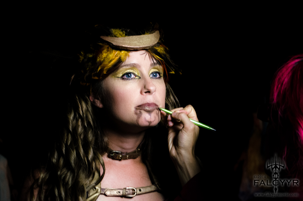 Kazi fixes my makeup between takes. Every once in awhile I rub my chin and the design smudges....ahhh! Photo courtesy of Unicovia Pictures.
