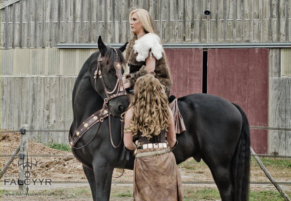 Checking Sinari's stirrups. Isn't Douwe so cute!