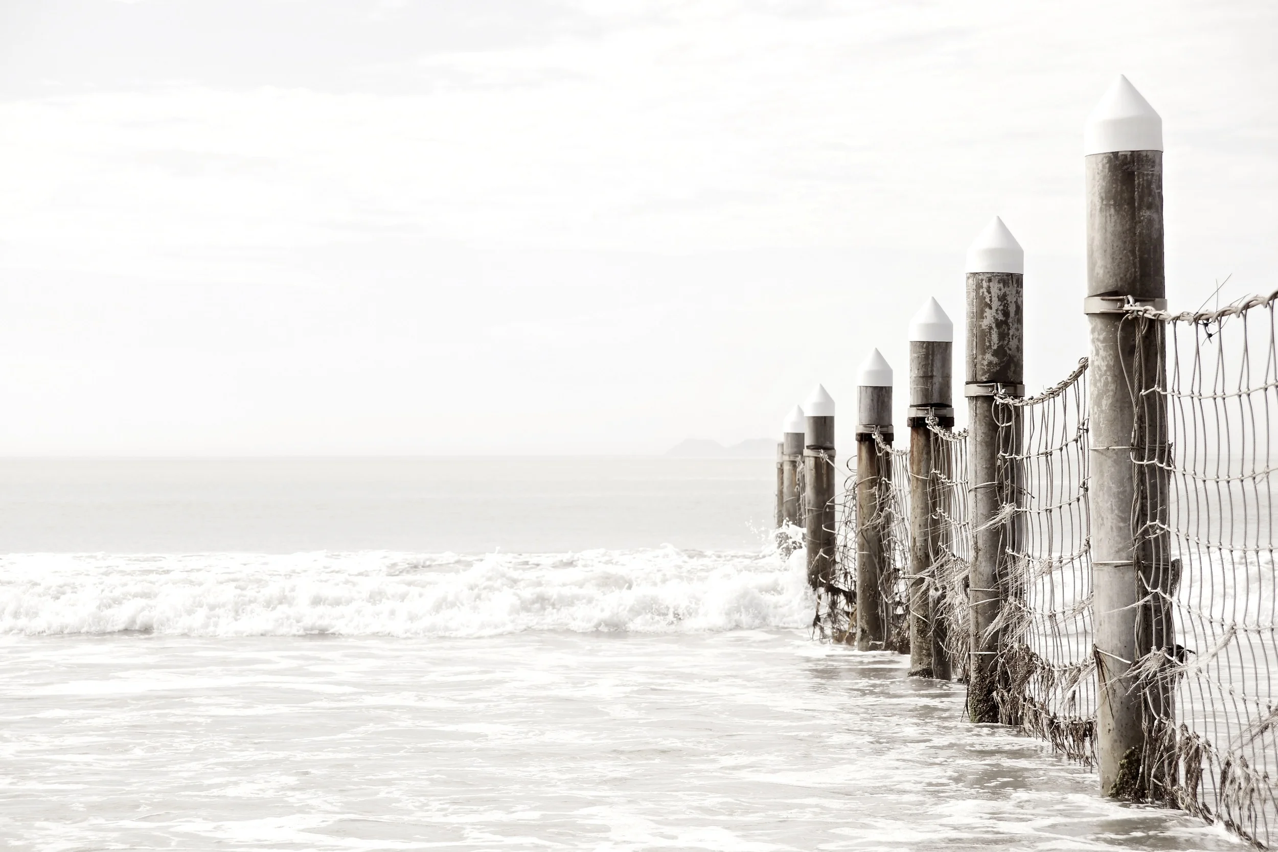 "Divide" Prior to 9/11, the Navy Seal base on Coronado Island was practically accessible to the public. Today, a barrier separates the beach from the Naval base.