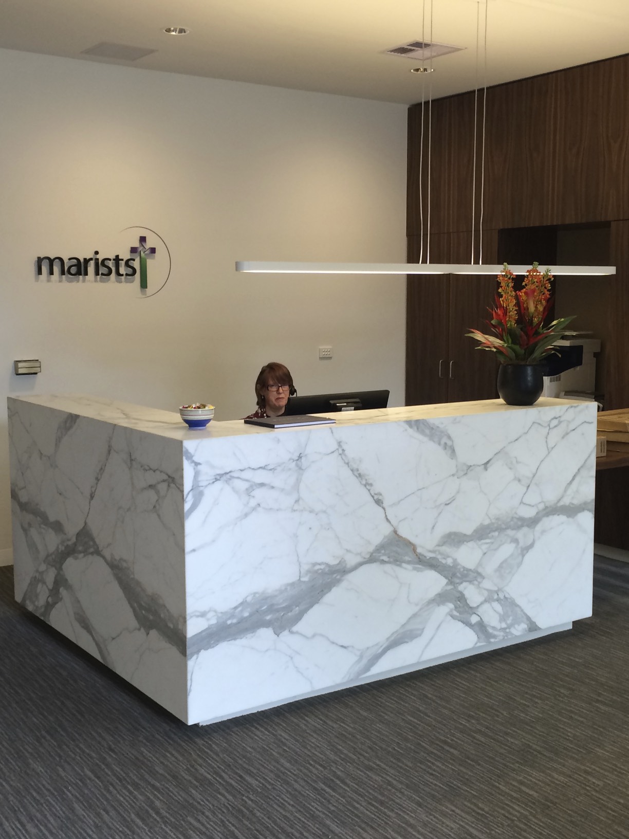 Tracey Doublet working in Reception at the newly refurbished Marist Centre Melbourne