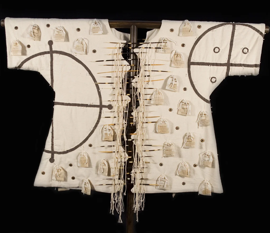 Carlota War Shirt, (Cuba) Materials: Cotton Textile, Cotton Muslin, Cotton Batting,
Porcupine Quills, Wood Discs, Metal Sequins, Glass Beads, Brown Sugar, Tea,
Plastic Bags, Cotton Yarn, Poly/Cotton Thread Techniques: Hand Painting, Hand Quilting, Hand
Beading, Tea Staining, Digital Printing, Patternmaking, Garment
Construction
2010