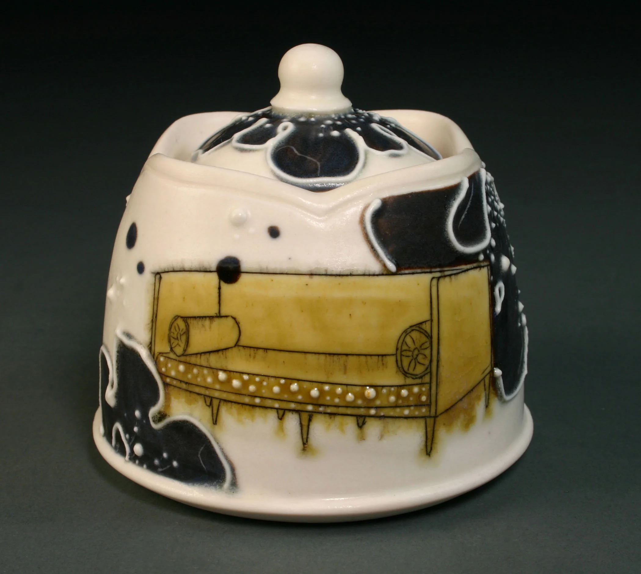  &nbsp;&nbsp;Porcelain decorated with hand drawn mishima, underglaze, slip trail, and glaze.  3.5" x 3" x 3", #20 