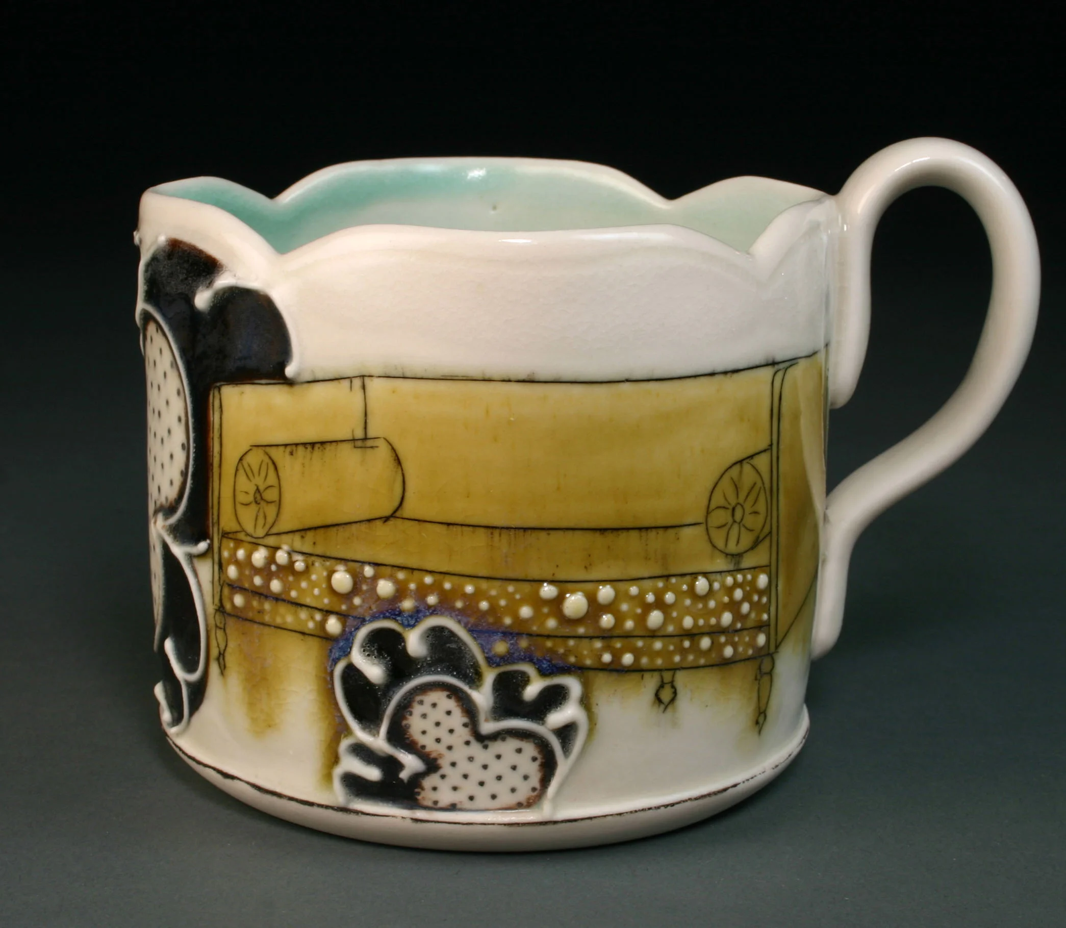  Porcelain decorated with hand drawn mishima, underglaze, slip trail, and glaze.  3.5" x 4" x 4"    