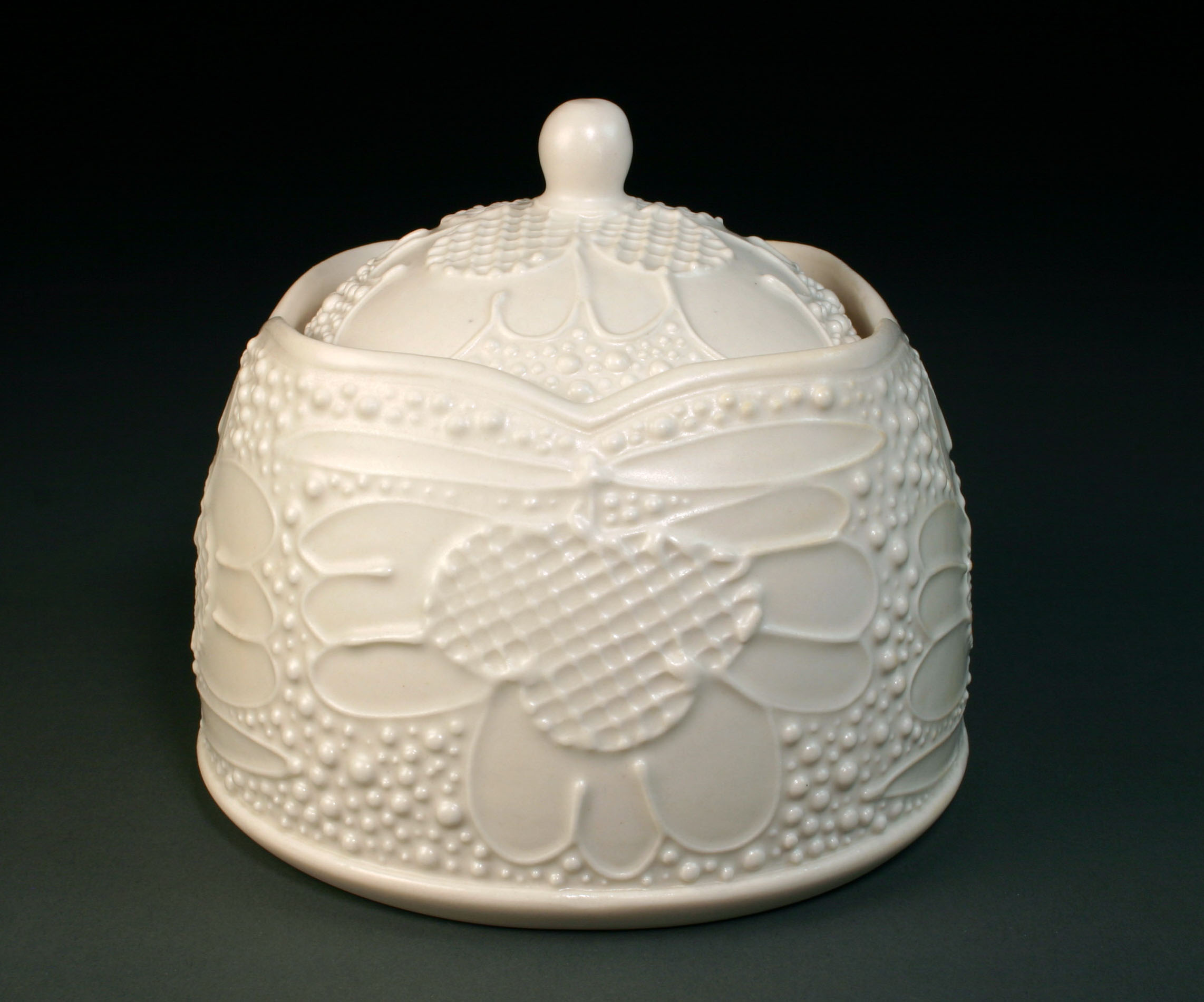  Porcelain decorated with slip trail. &nbsp;Wheel thrown body and slab built lid. &nbsp;  4.5" x 4.5" x 4.5", #6 