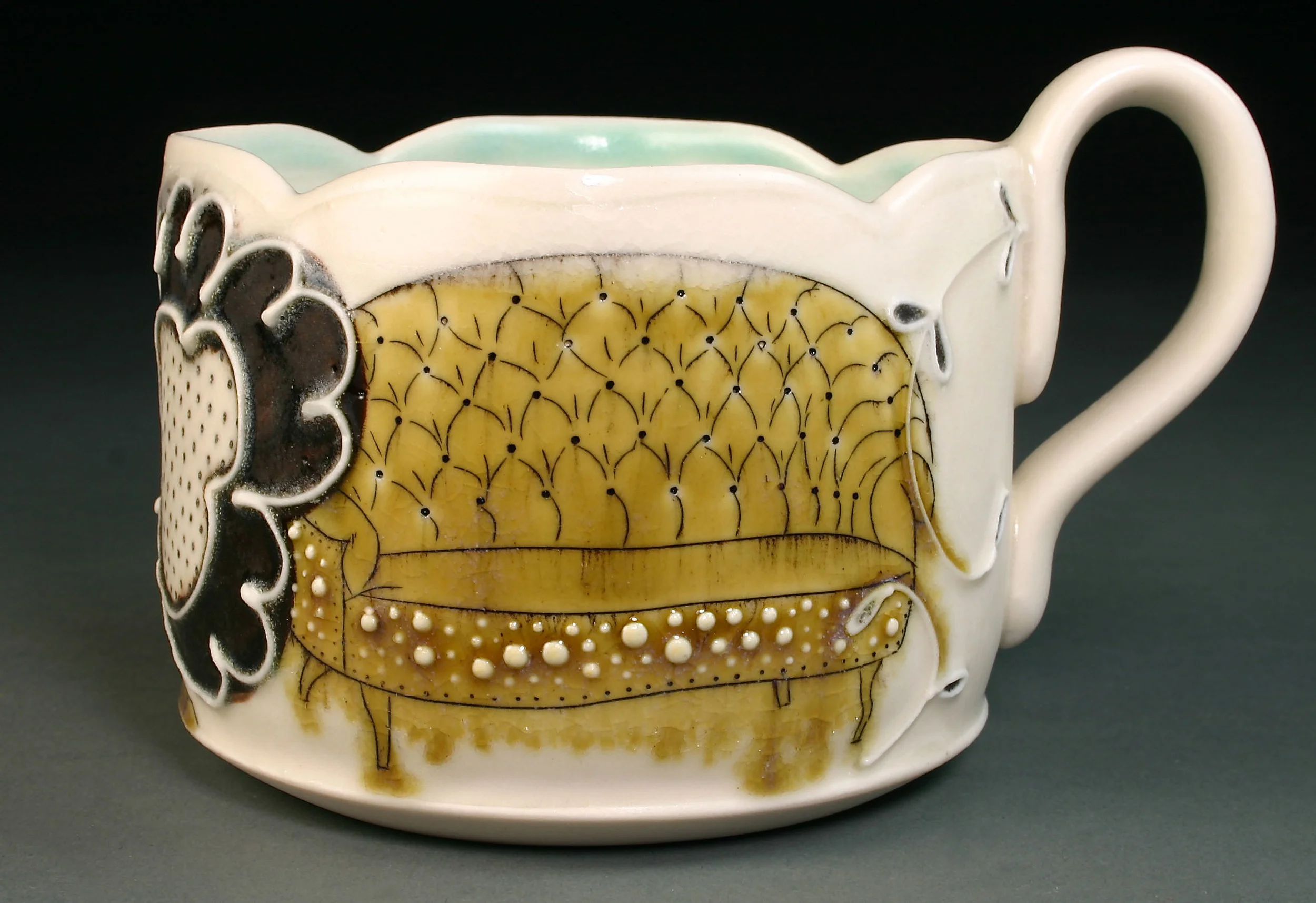  Porcelain decorated with hand drawn mishima, underglaze, slip trail, and glaze.  3" x 4" x 4" 