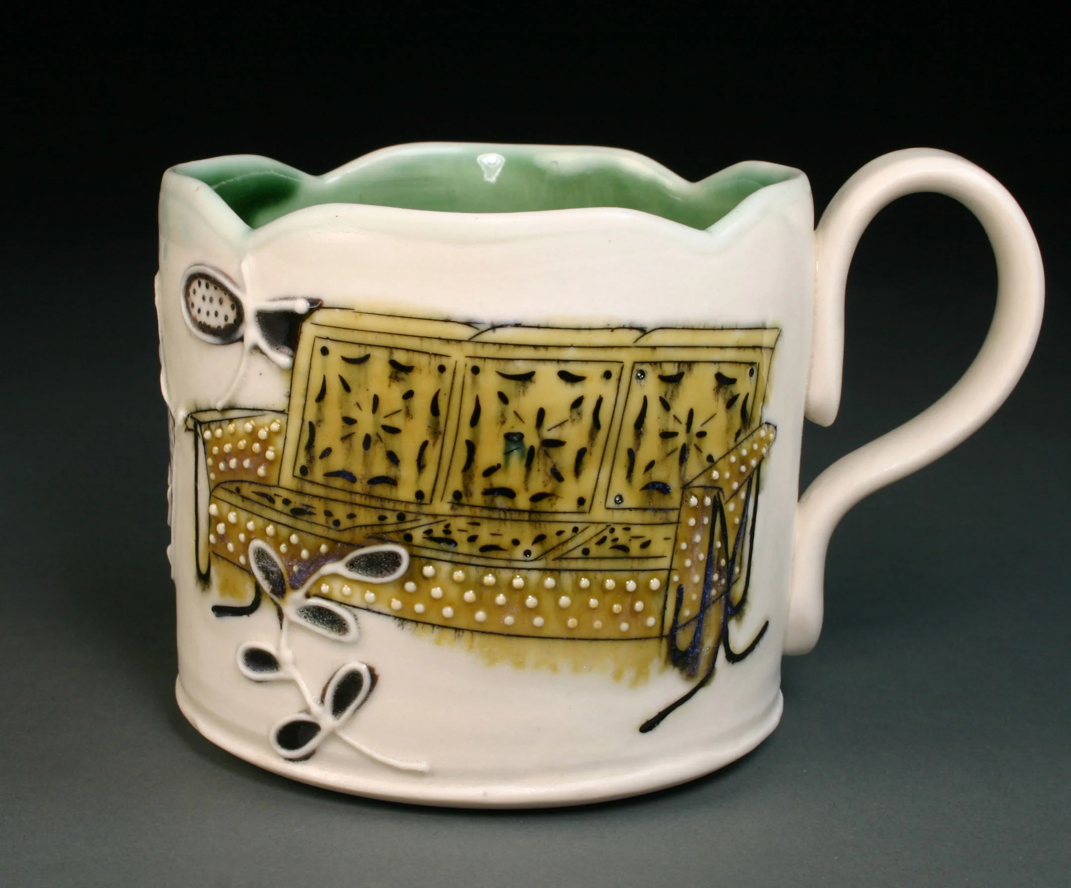  Porcelain decorated with hand drawn mishima, underglaze, slip trail, and glaze.  3.5" x 4"&nbsp; x 4" 