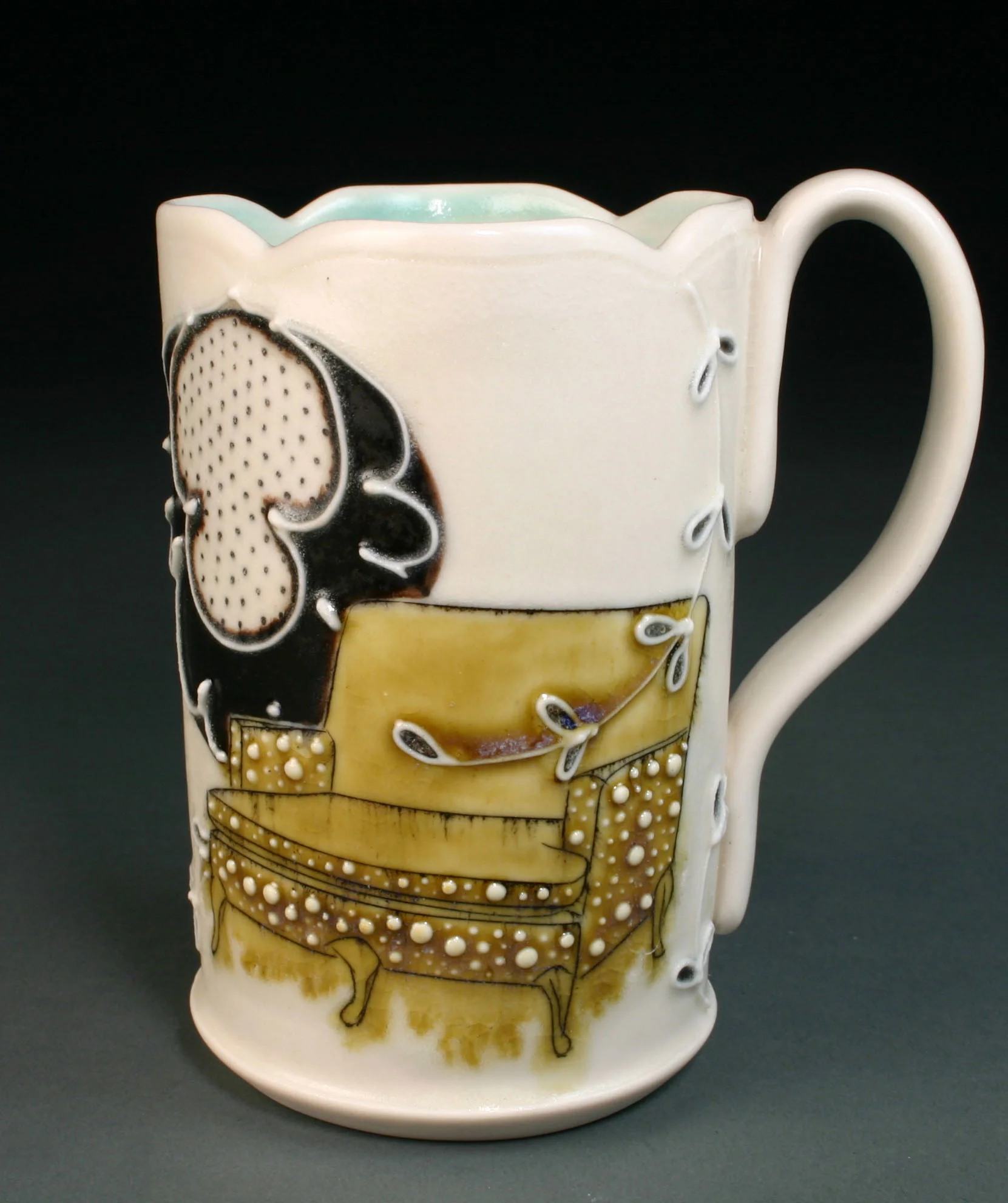  Porcelain decorated with hand drawn mishima, underglaze, slip trail, and glaze.  4" x 3" x 3" 