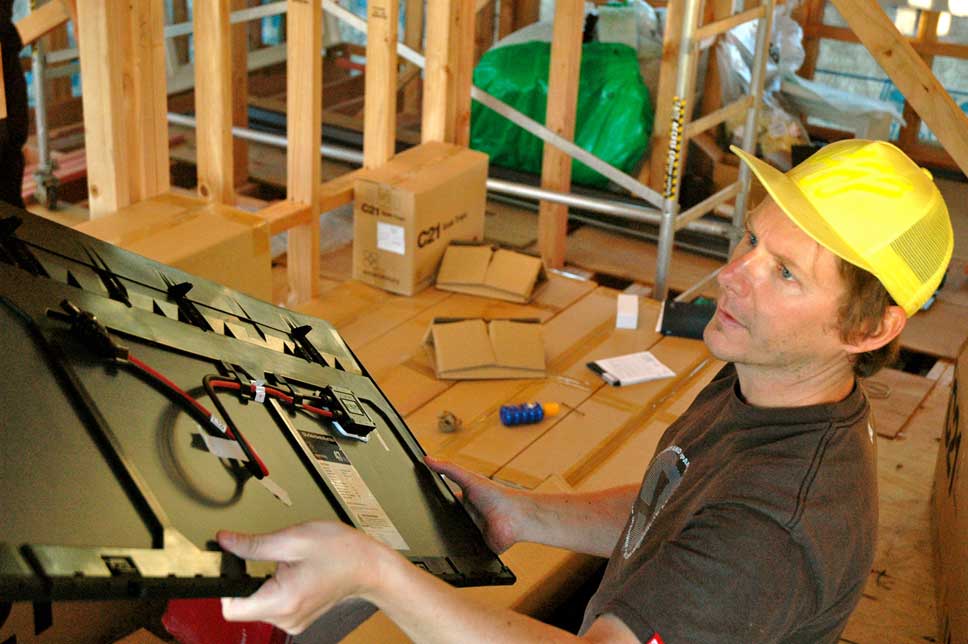  Matt passing out panels from the second floor window. You can see the individual panel wiring. 