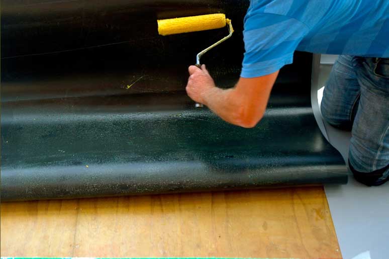    Applying glue to the underside of panel. 