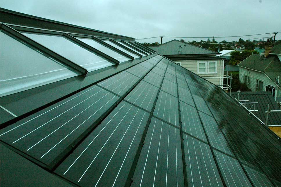  Shot of the completed roof. Eight solar water heating collectors; 88 solar photovoltaic panels. 