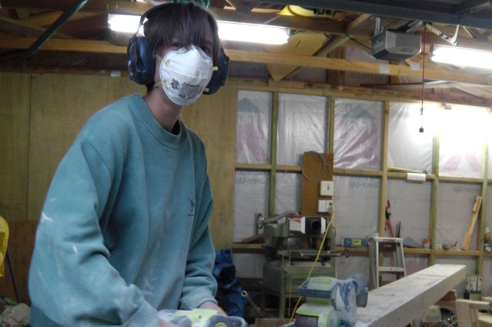    Jo sanding back the beams. 