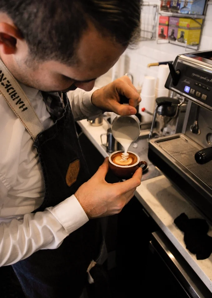 Jesús preparing a Macchiato
