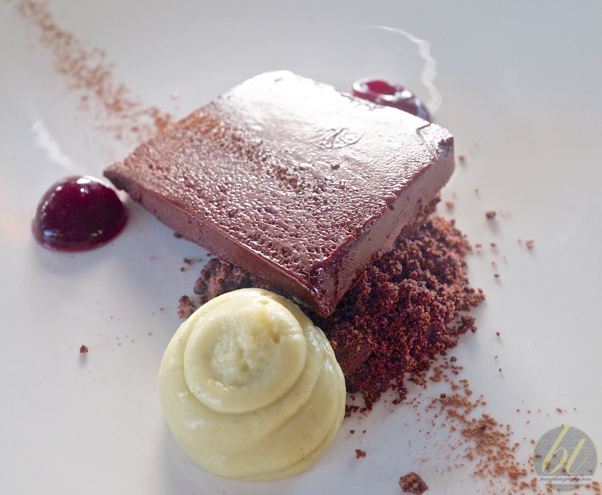 Chocolate marquise, pistachio cream, chocolate crumbs, red wine gel ($15)