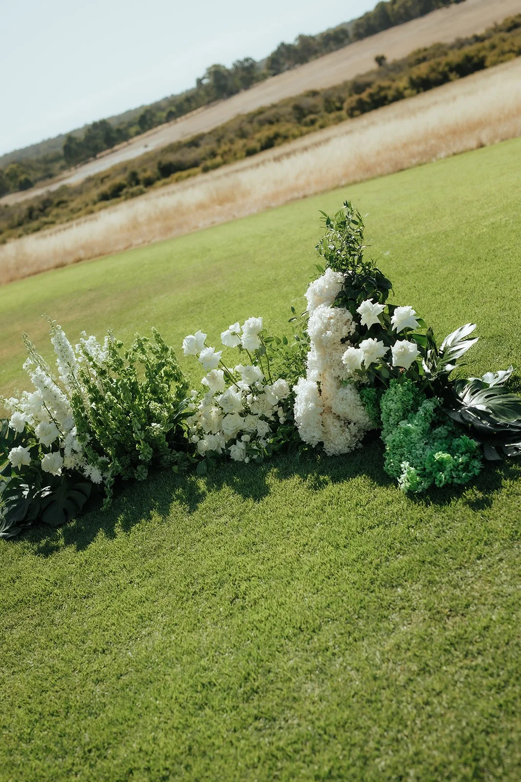 Lara-Brandon-ceremony-floral-arch-detail.jpg