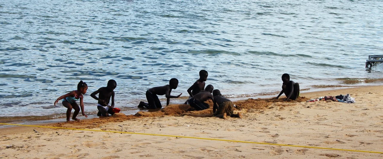 kids playing on the Cape Maclear beach