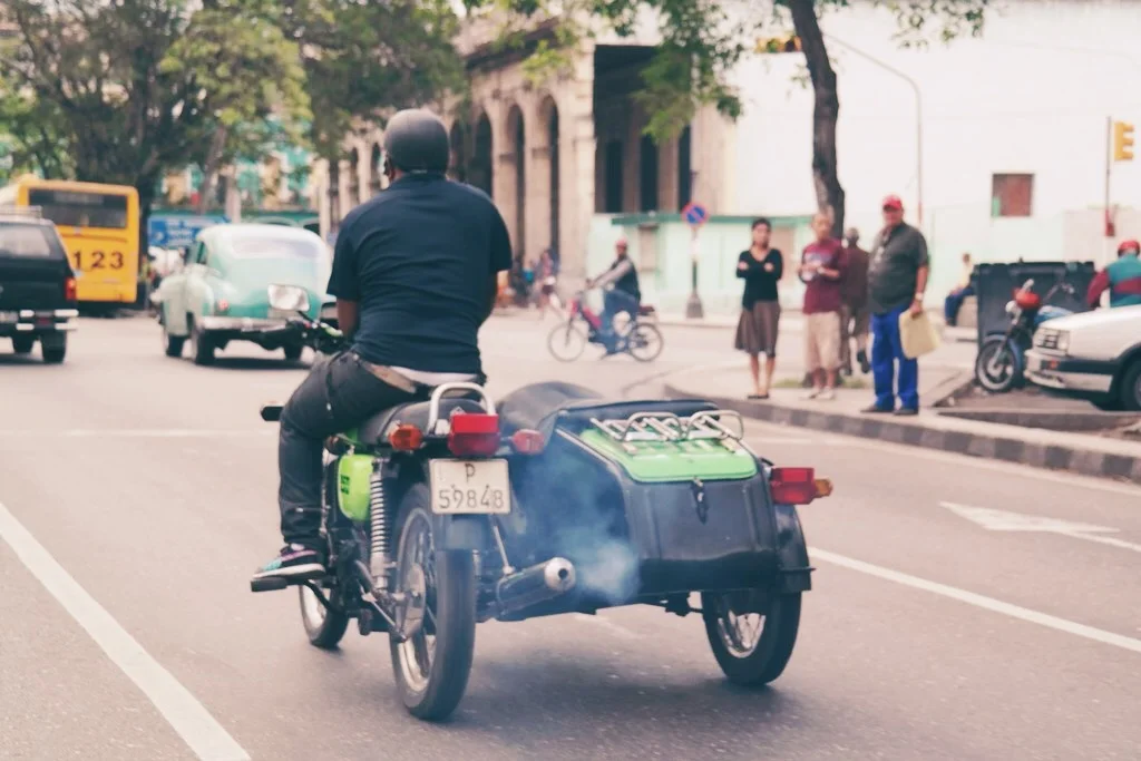 so many motorbikes with side cars in Havana