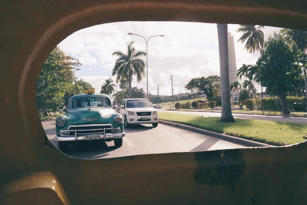 looking out the back "window" of a Coco taxi