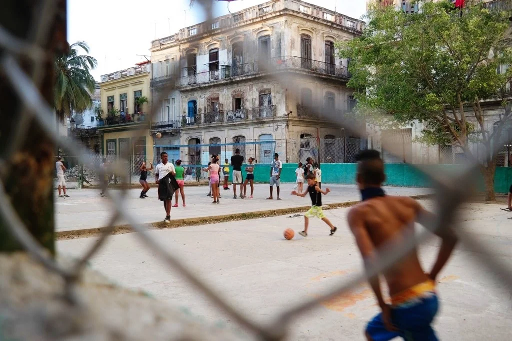 kids playing soccer &amp; volleyball after school in Old Havana