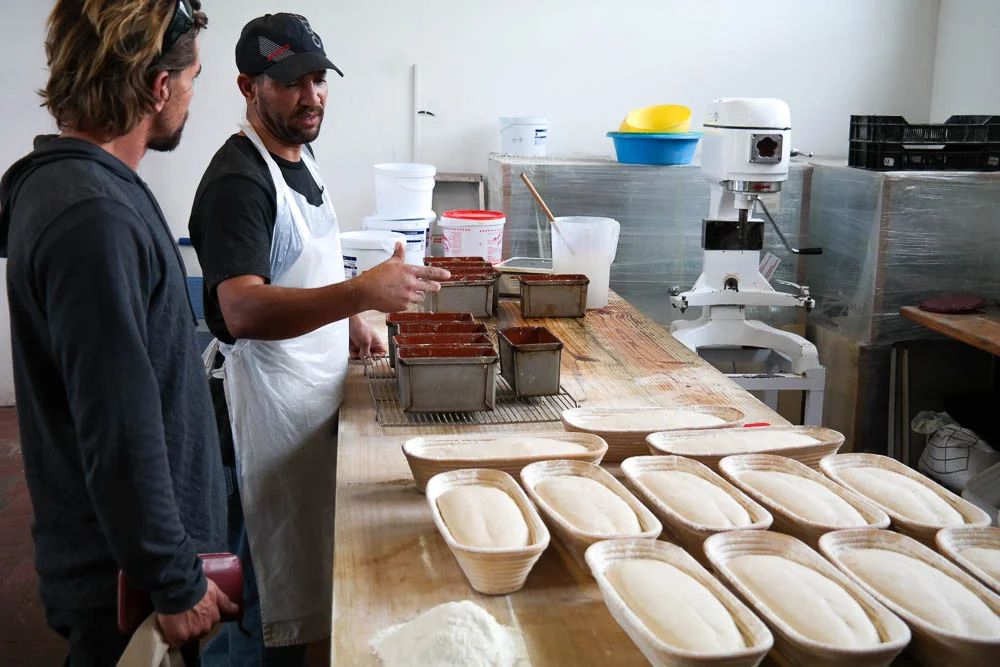 baker explaining to Rufus how the magic is made
