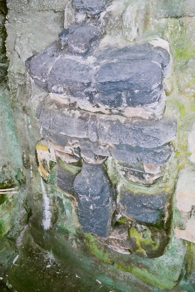 A massive stucco mask found on the substructure of one of the temples