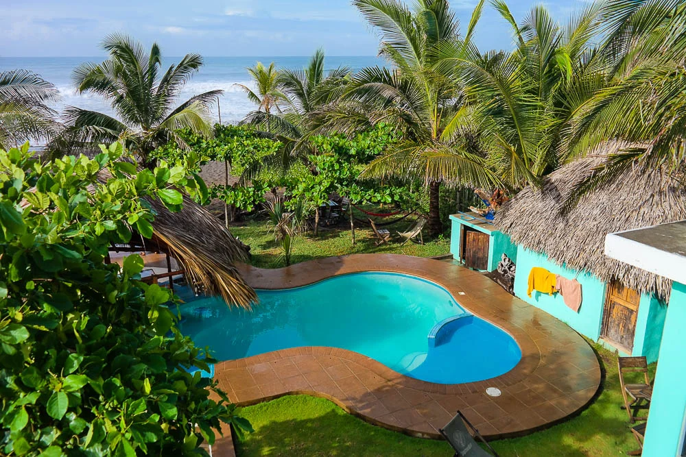 pool with the bar hiding behind the bush on the left