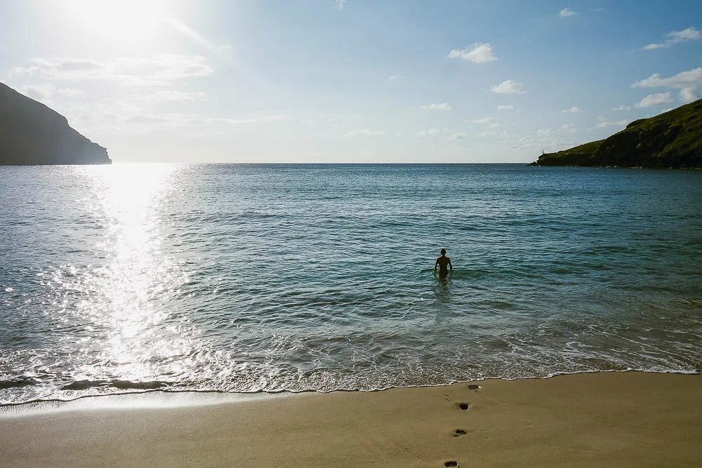 the best part of the day - Rufus taking the first dip on the deserted beach