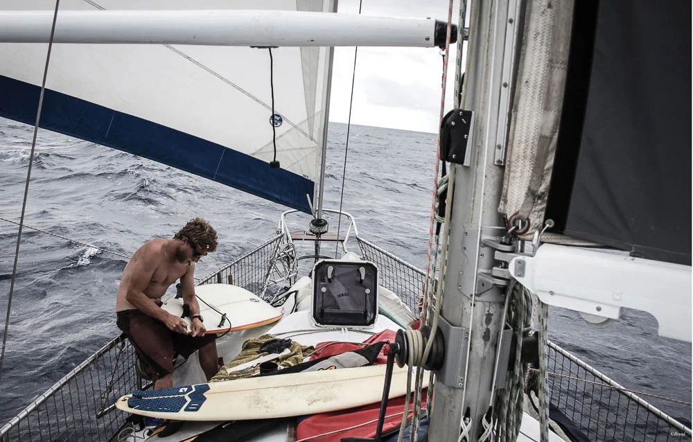 Rufus' photo of Wilhem repairing boards as we crossed the Atlantic, ready to surf in Brazil!