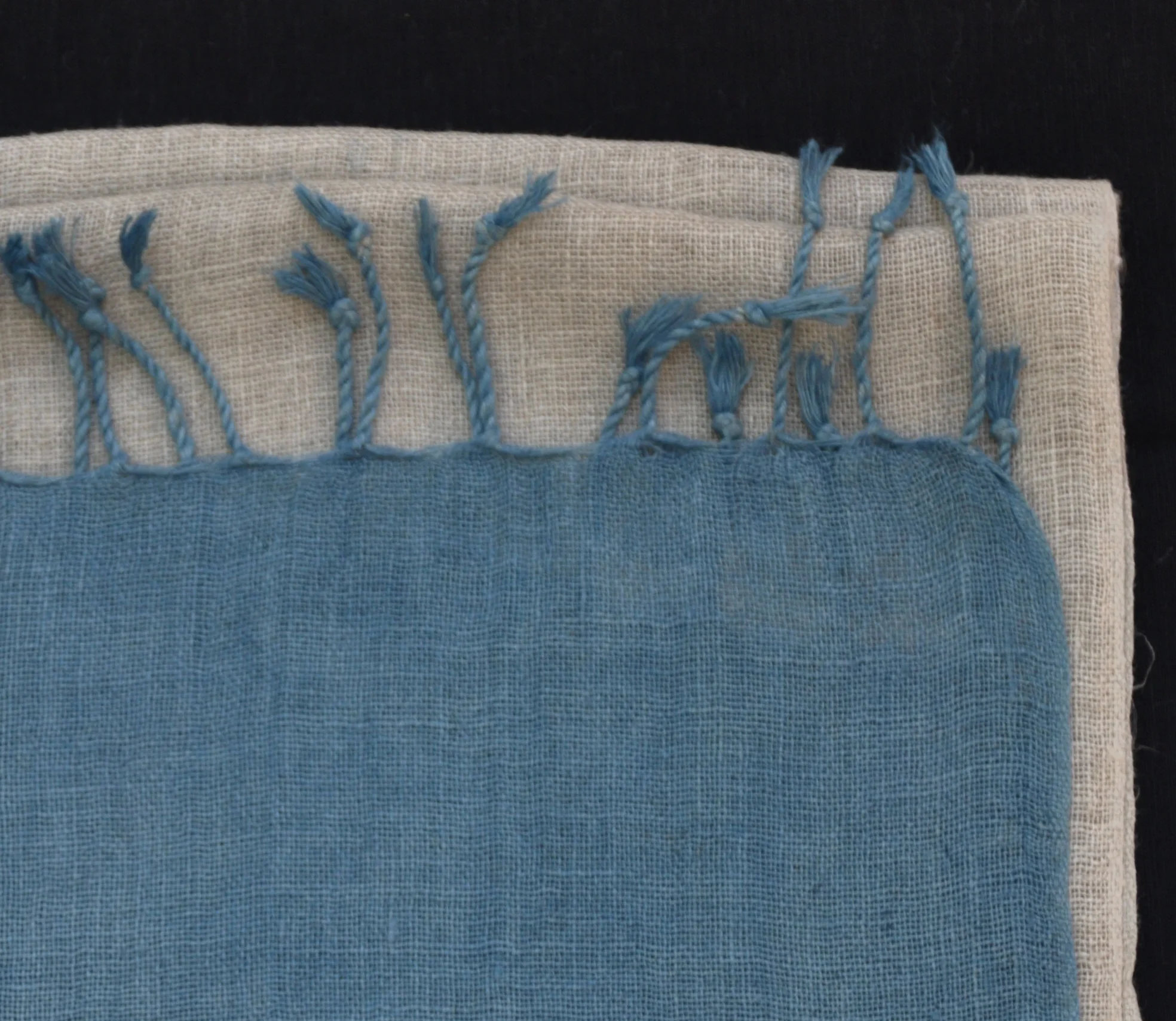 Folded linen scarf with indigo