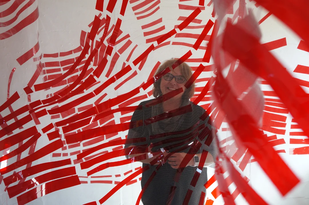 Christine Mauersberger standing amid her work while at the Vermont Studio Center in 2015 photo: Howard Romero