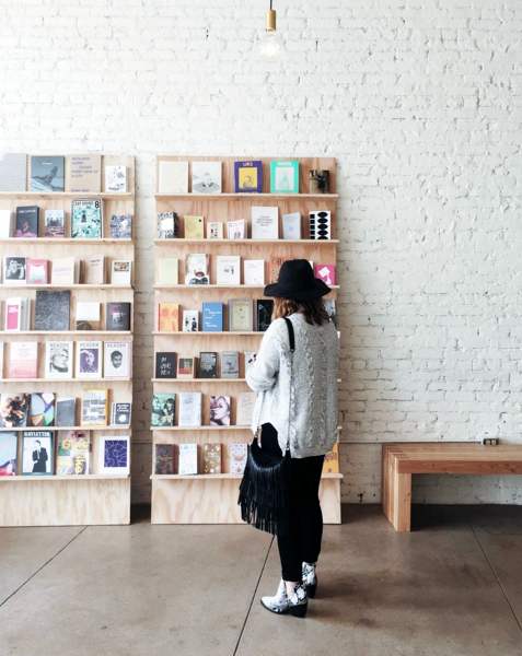 The art book wall at Eightfold Coffee Shop
