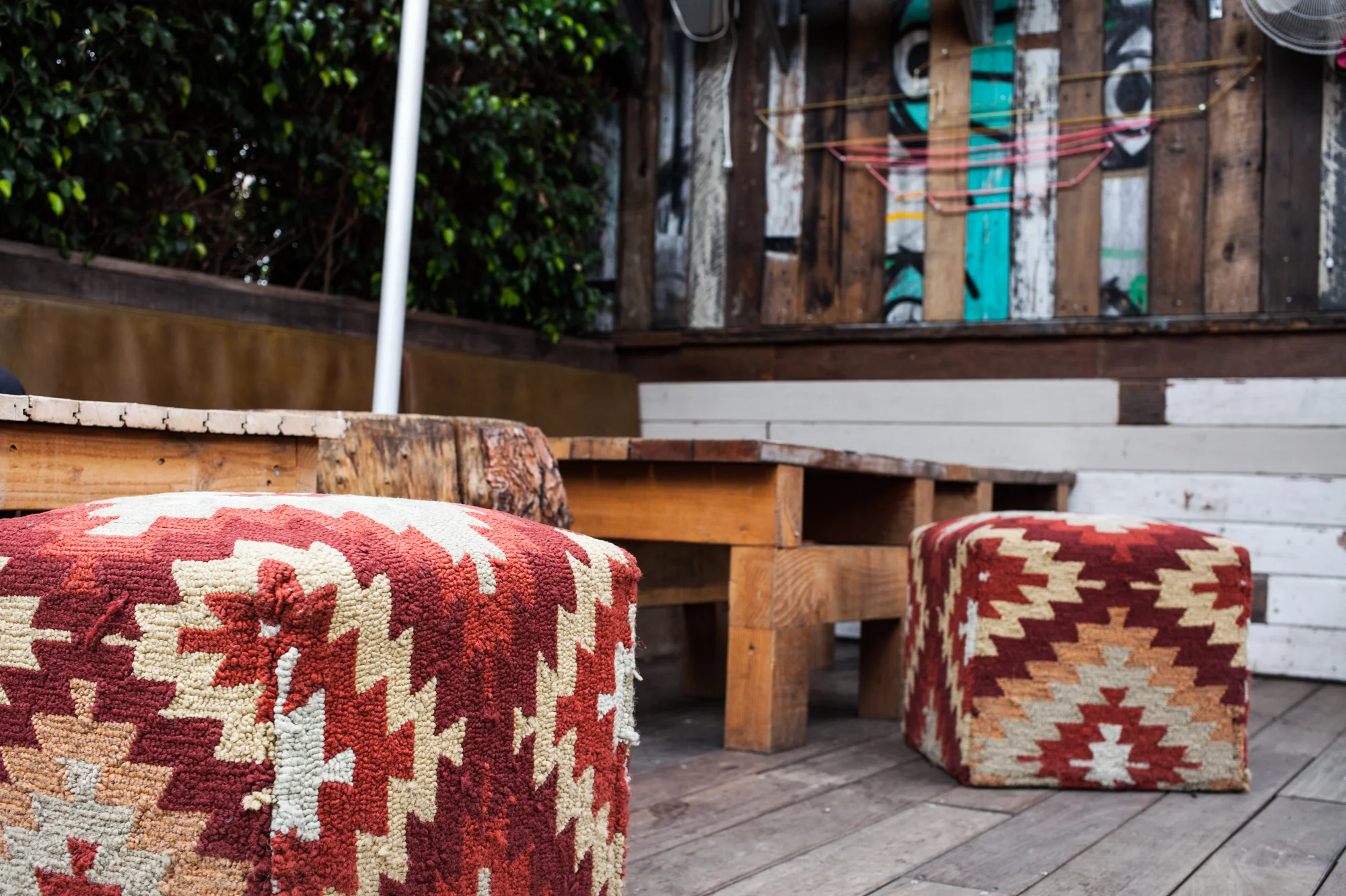 Patio inspiration: weather-proof poufs for a dash of color. 