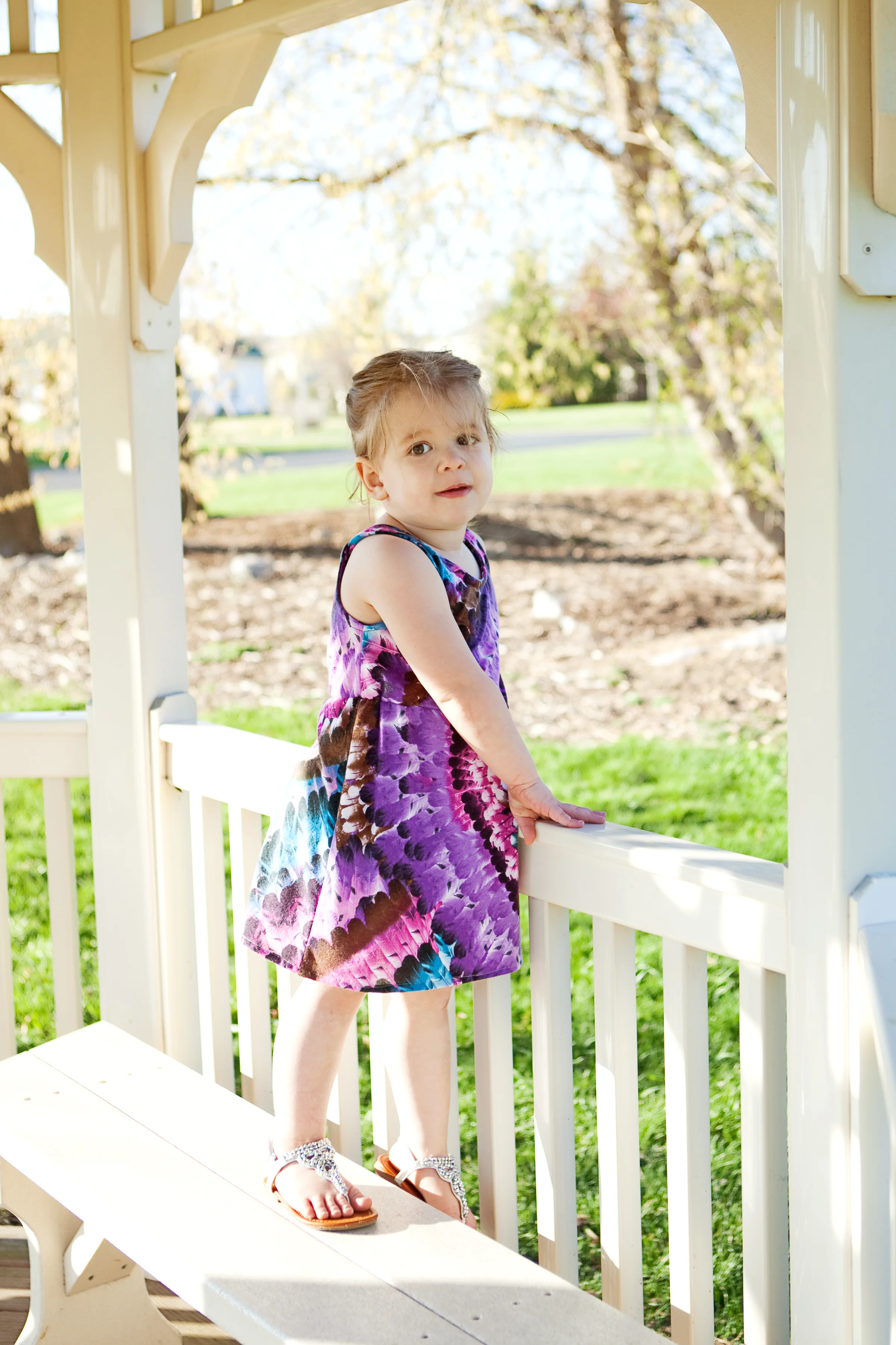 here's my baby rocking the California in Purple Blue Feather Rows by Girl Charlee