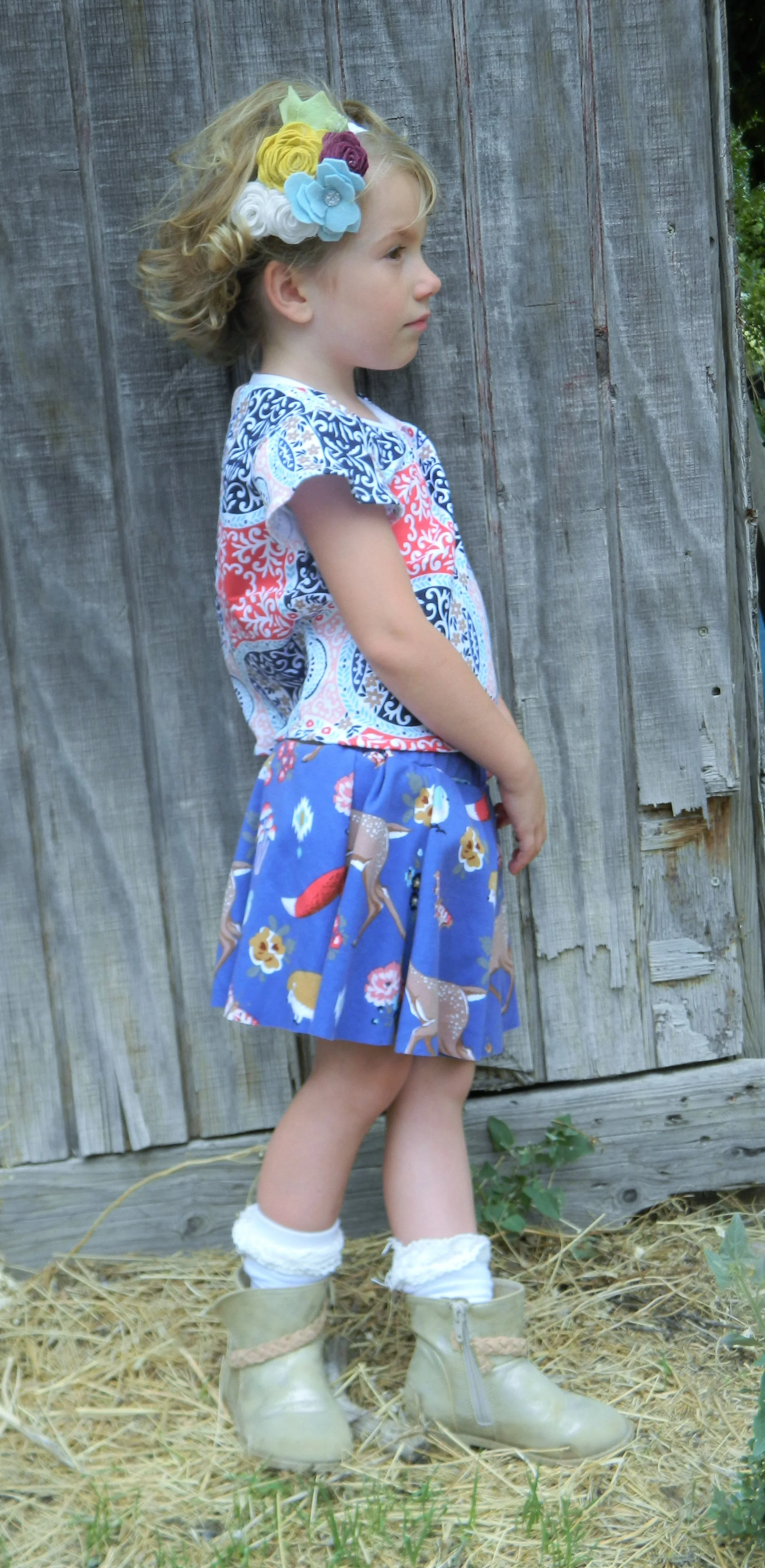 Swing Set Skort, Butterfly Blouse, and Coco Flower crown sewn by Nicole