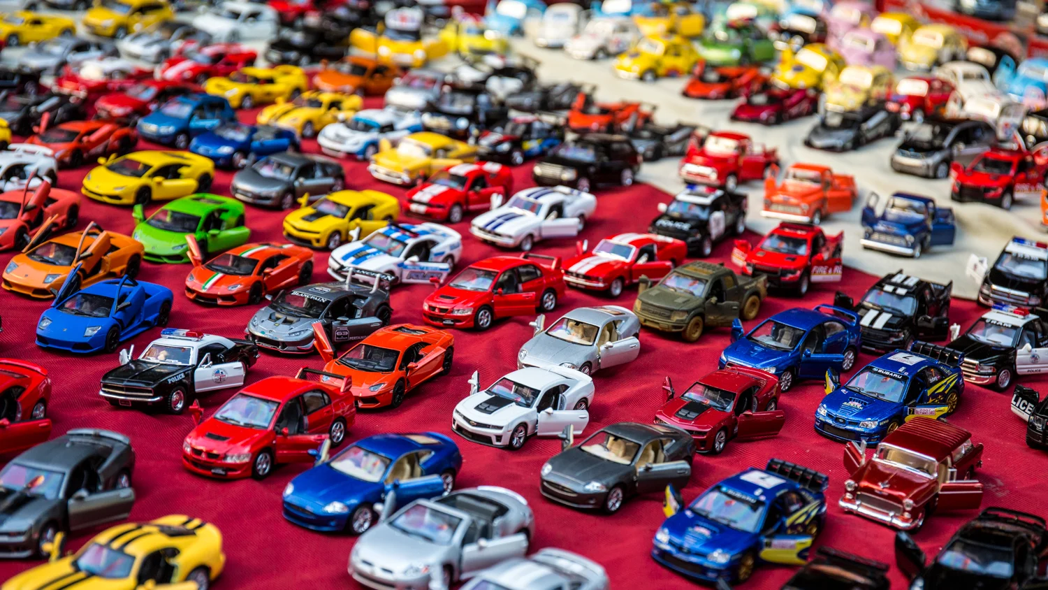 Model cars in a marketplace.