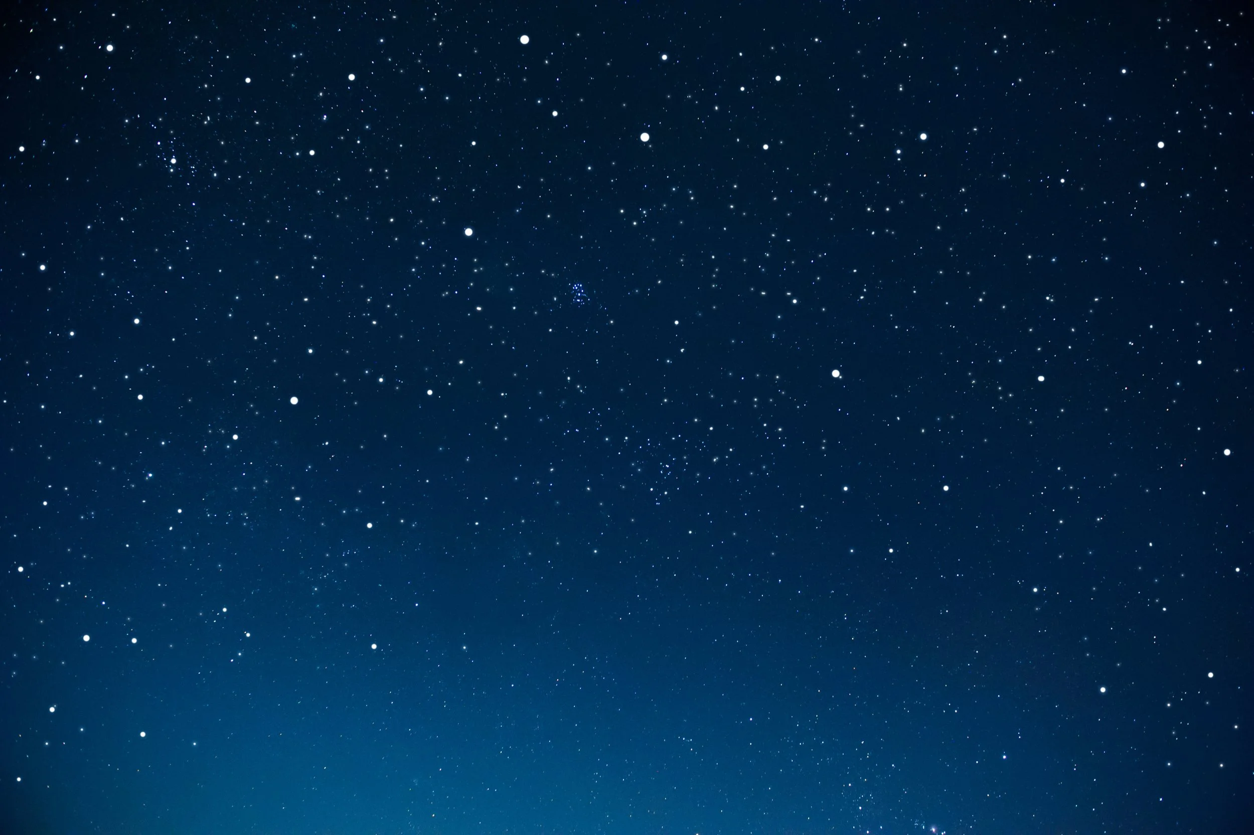 Clear night sky filled with numerous stars of varying sizes and brightness.