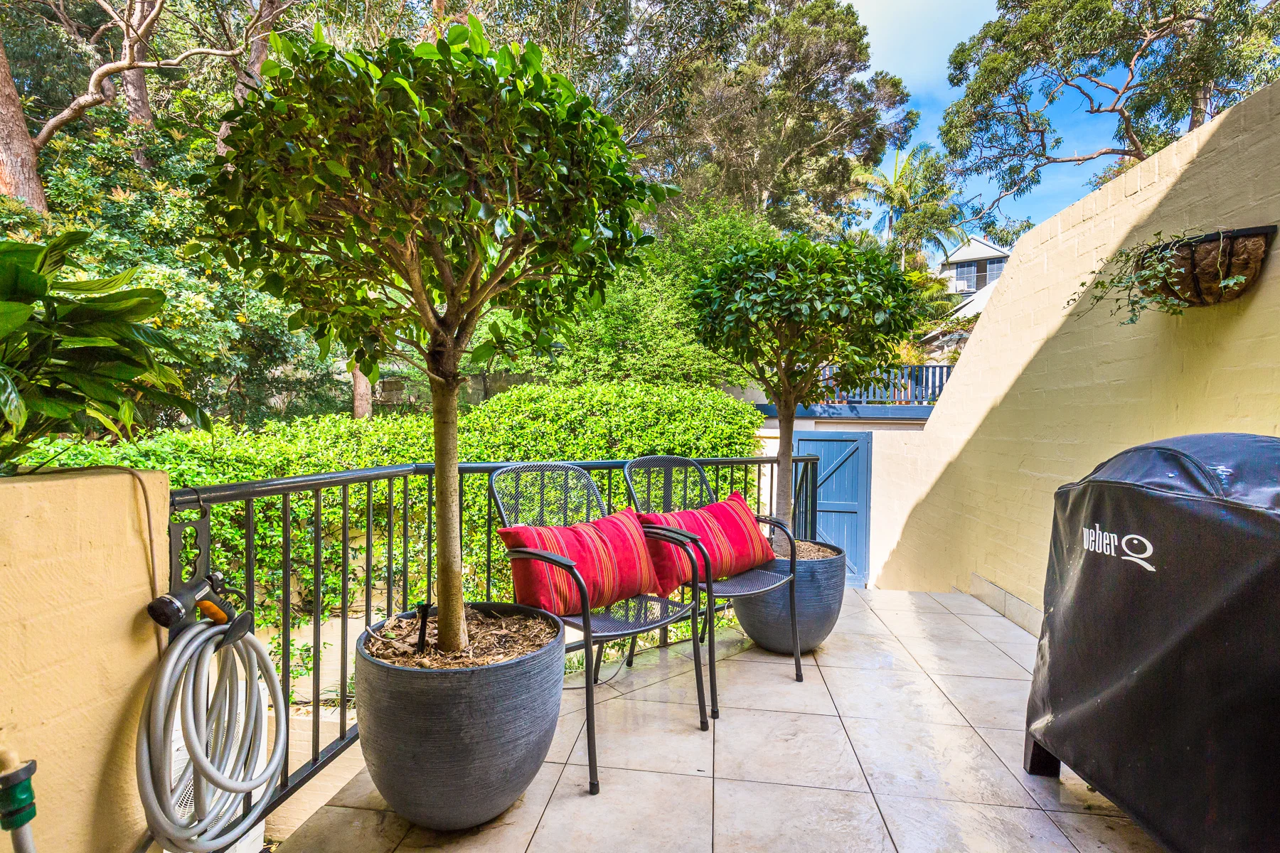 The upper back balcony and barbecue area.