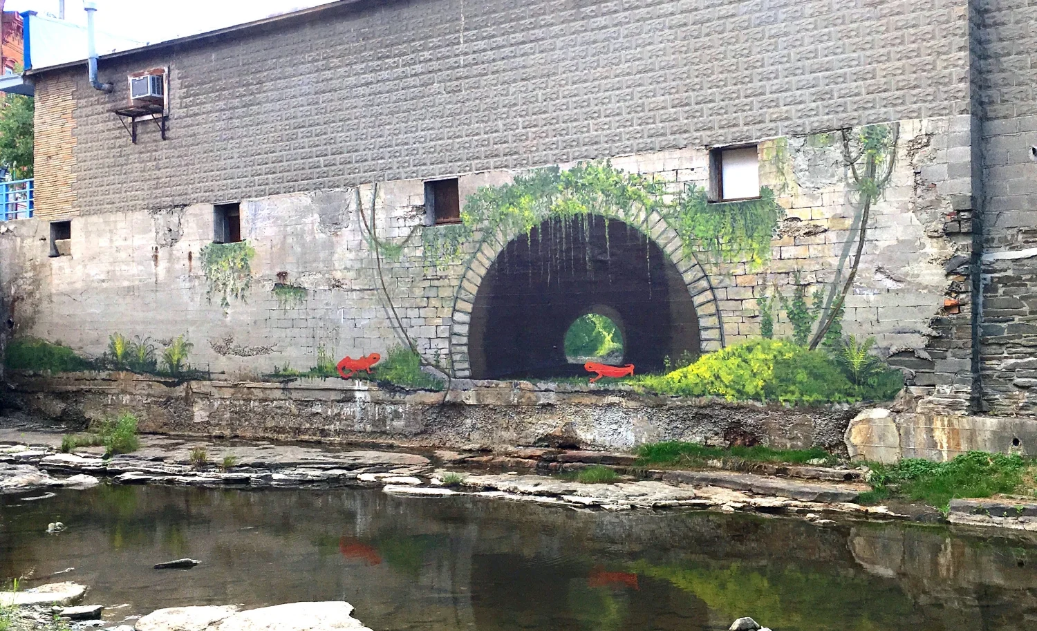 Here, the first phase is done. We hope to add to the left side of the wall near the bridge in the future.