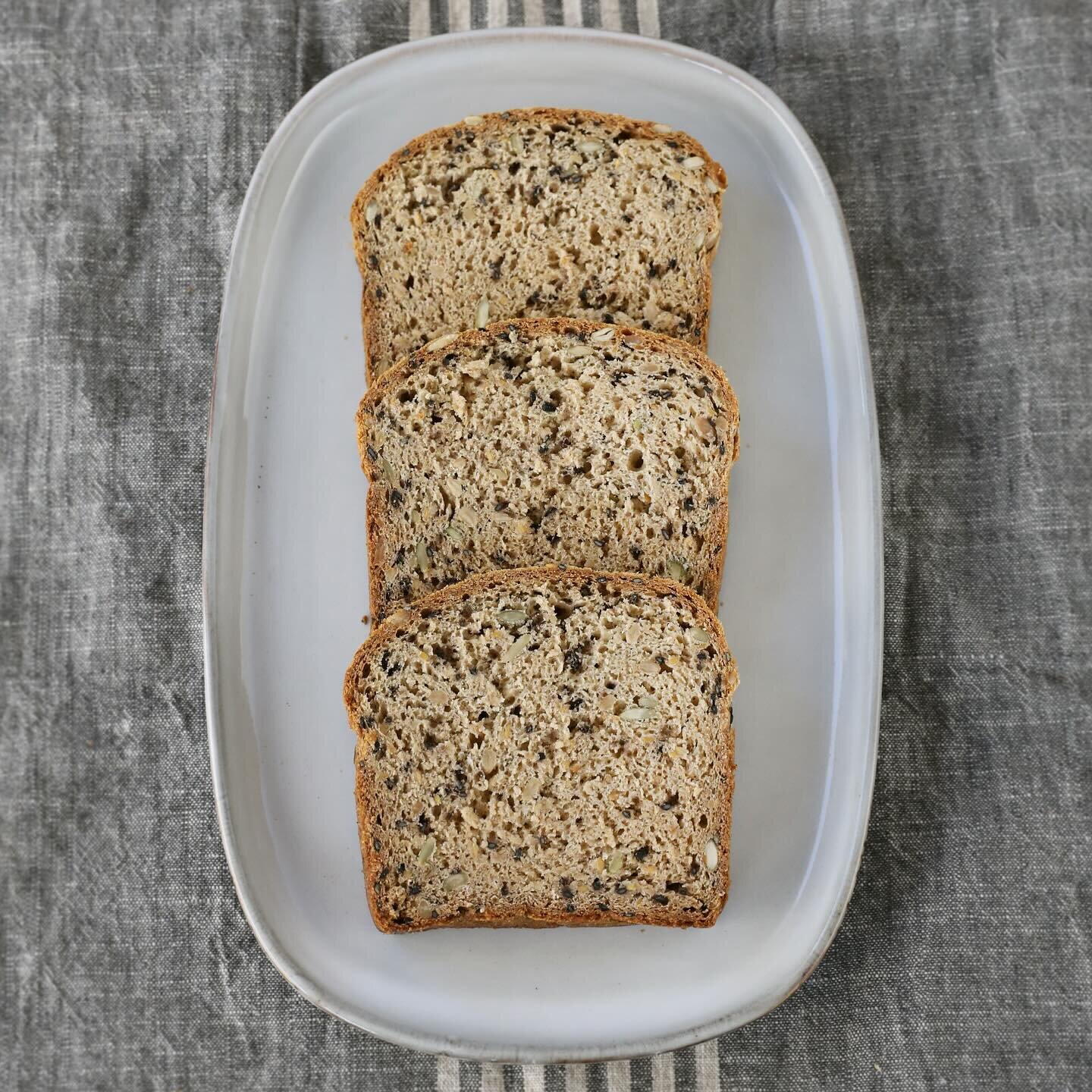 Stop in to stock up on bread before the snow! We have seeded bread (pictured here), sourdough, sandwich bread + focaccia waiting for you. 🍞 

#glutenfreebread #veganbread #gfbread #bread #madefromscratch #glutenfree #dairyfree #vegan #soyfree #minne