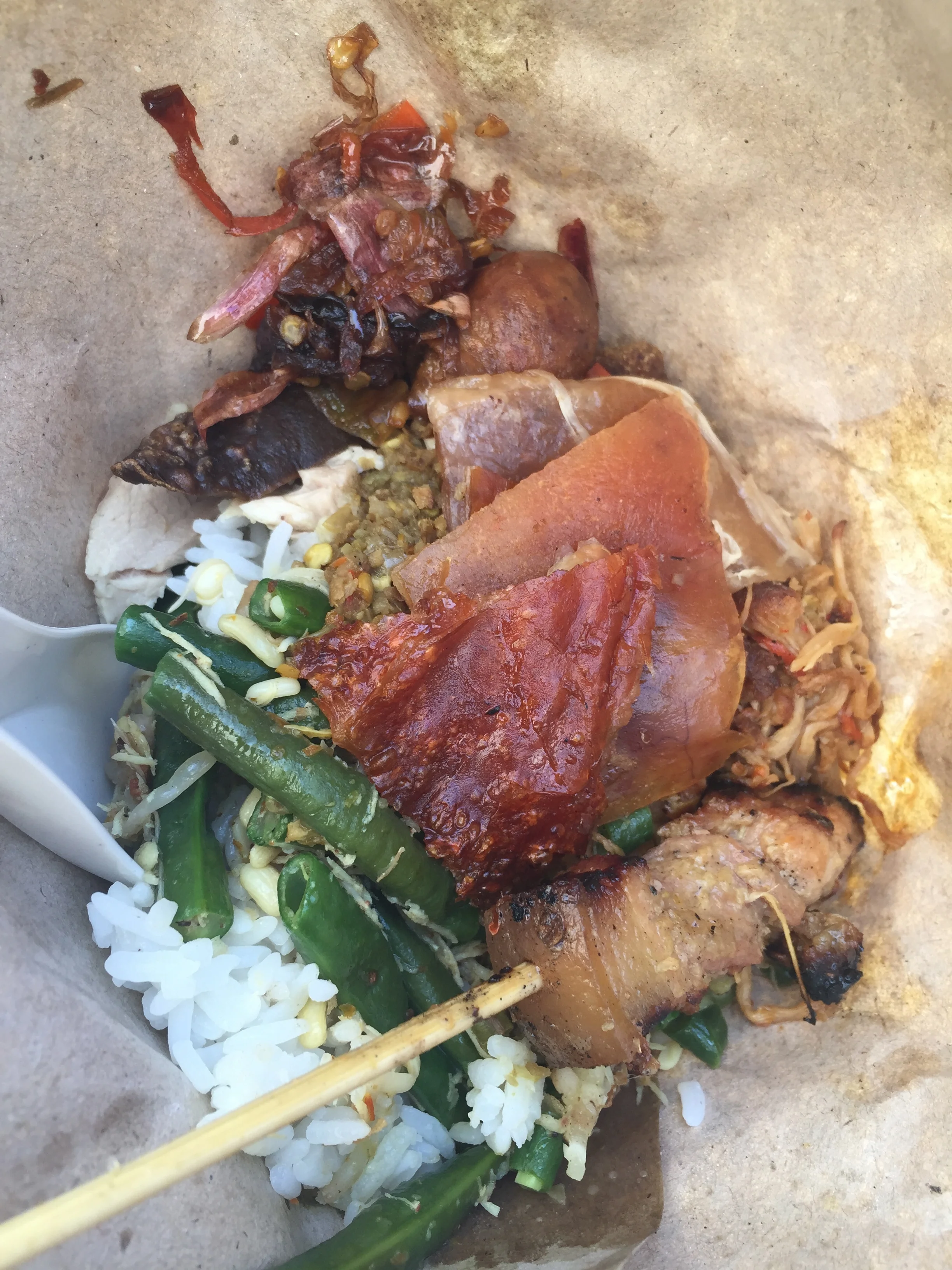 Balinese spit-roasted pig (babi guleng) with accompiniements