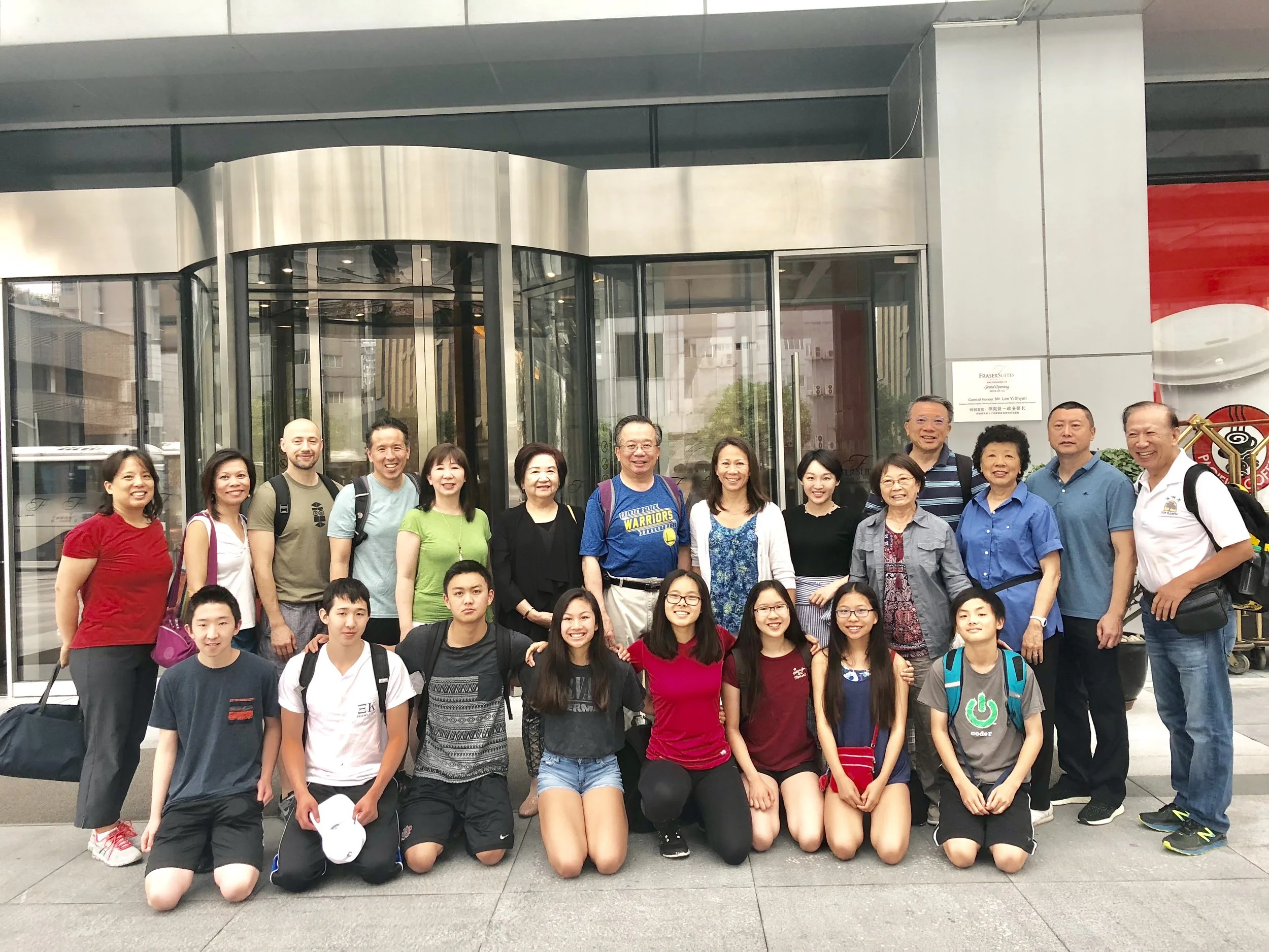 The Yin Expedition Team in front of our home away from home, Fraser Suites.
