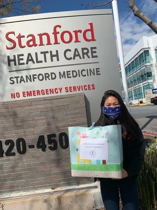 Sarah Lin, Yin Education Foundation 3rd generation, delivering donations to Stanford Healthcare.
